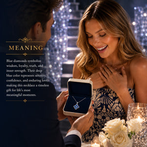 A man presents a blue diamond flower-shaped necklace in an open box to a smiling woman at a romantic table setting with candles and flowers. Text on the left explains the meaning of the blue diamond shape.