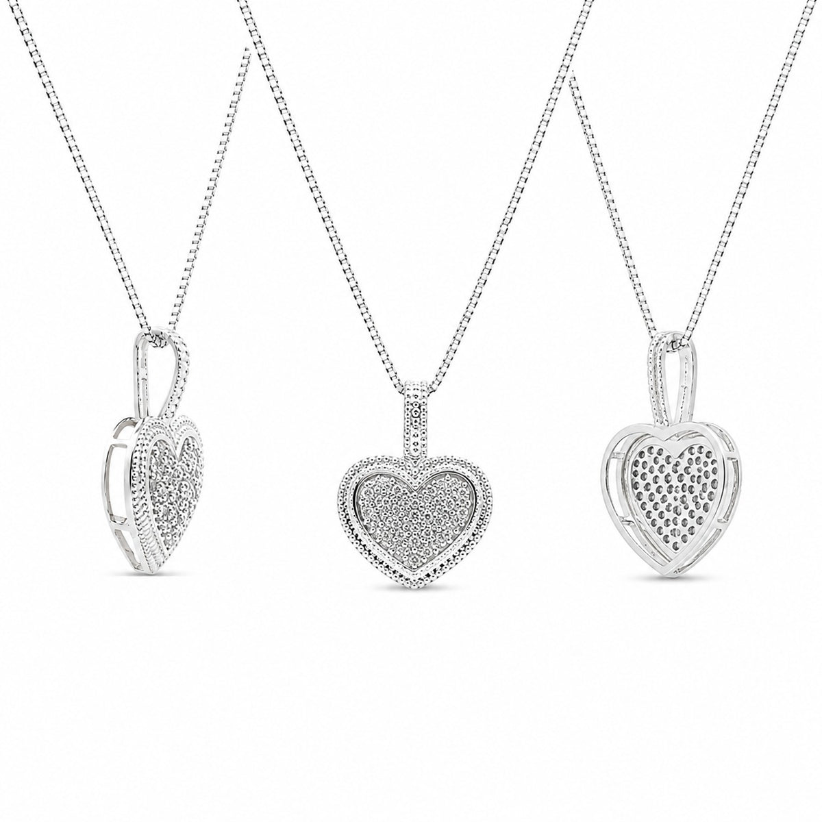 Three heart-shaped pendants on chains against a white background