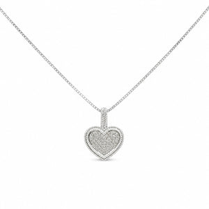 Heart-shaped diamond pendant on a chain against a white background