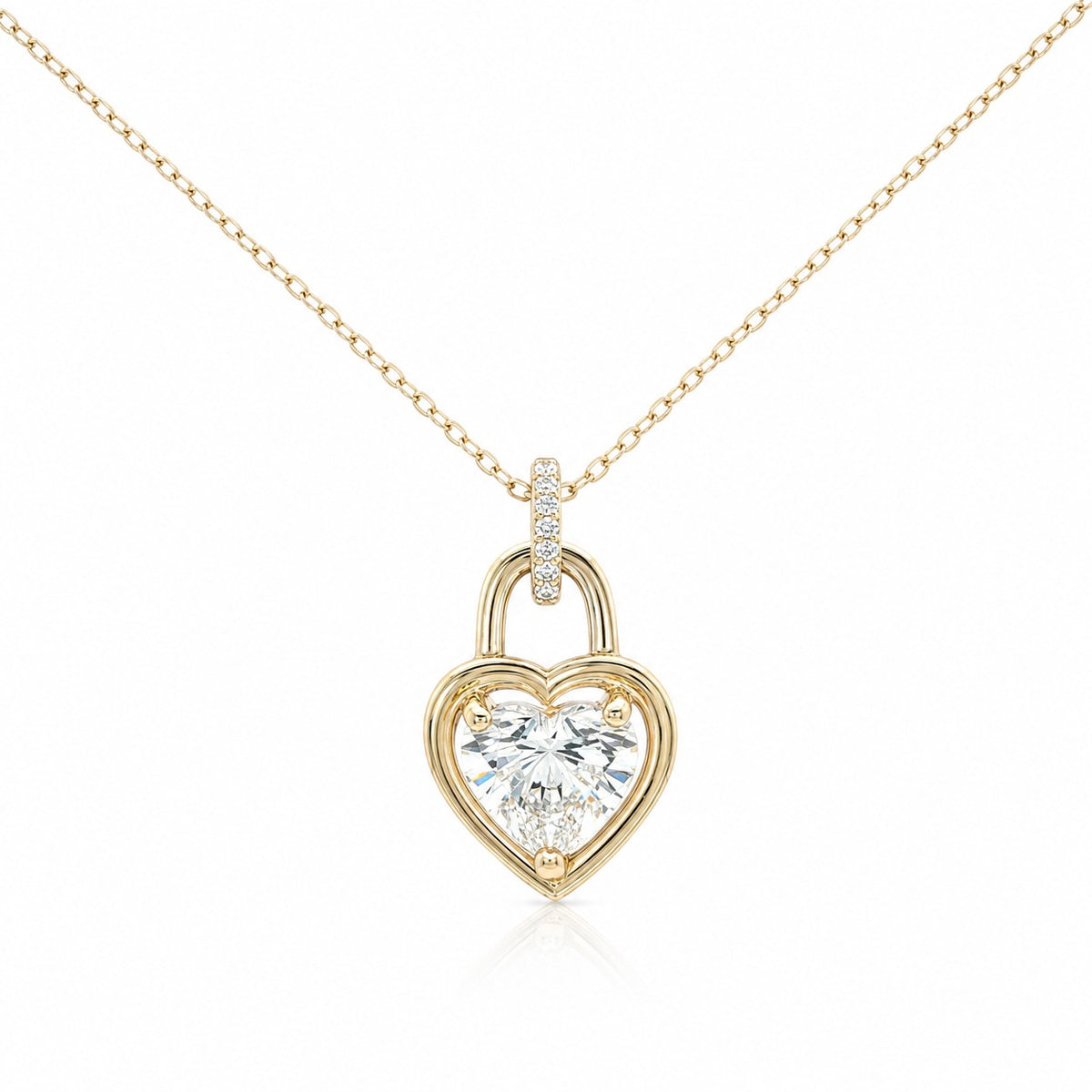 Gold heart-shaped lock pendant with diamonds on a white background