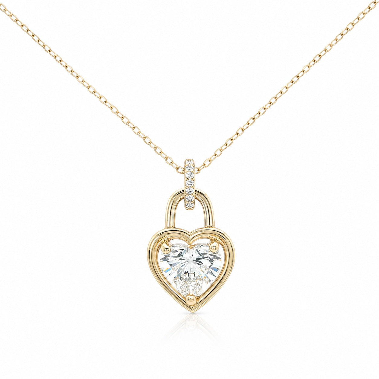 Gold heart-shaped lock pendant with diamonds on a white background