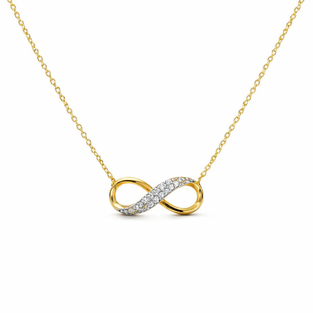 Gold infinity necklace with diamond accents on a white background