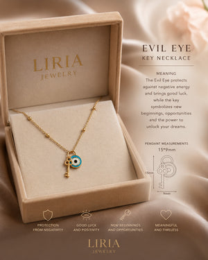 Liria Jewelry Evil Eye Key Necklace in a beige presentation box, displayed on a draped satin fabric background with product details and text overlays.