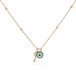 A gold chain necklace featuring a key and an evil eye charm pendant, displayed against a clean white background.