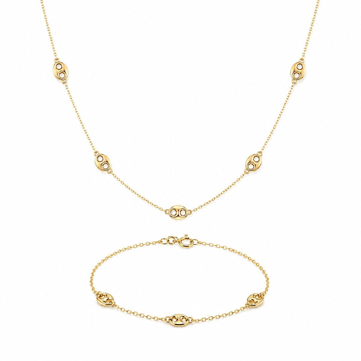Gold necklace and bracelet set on a white background