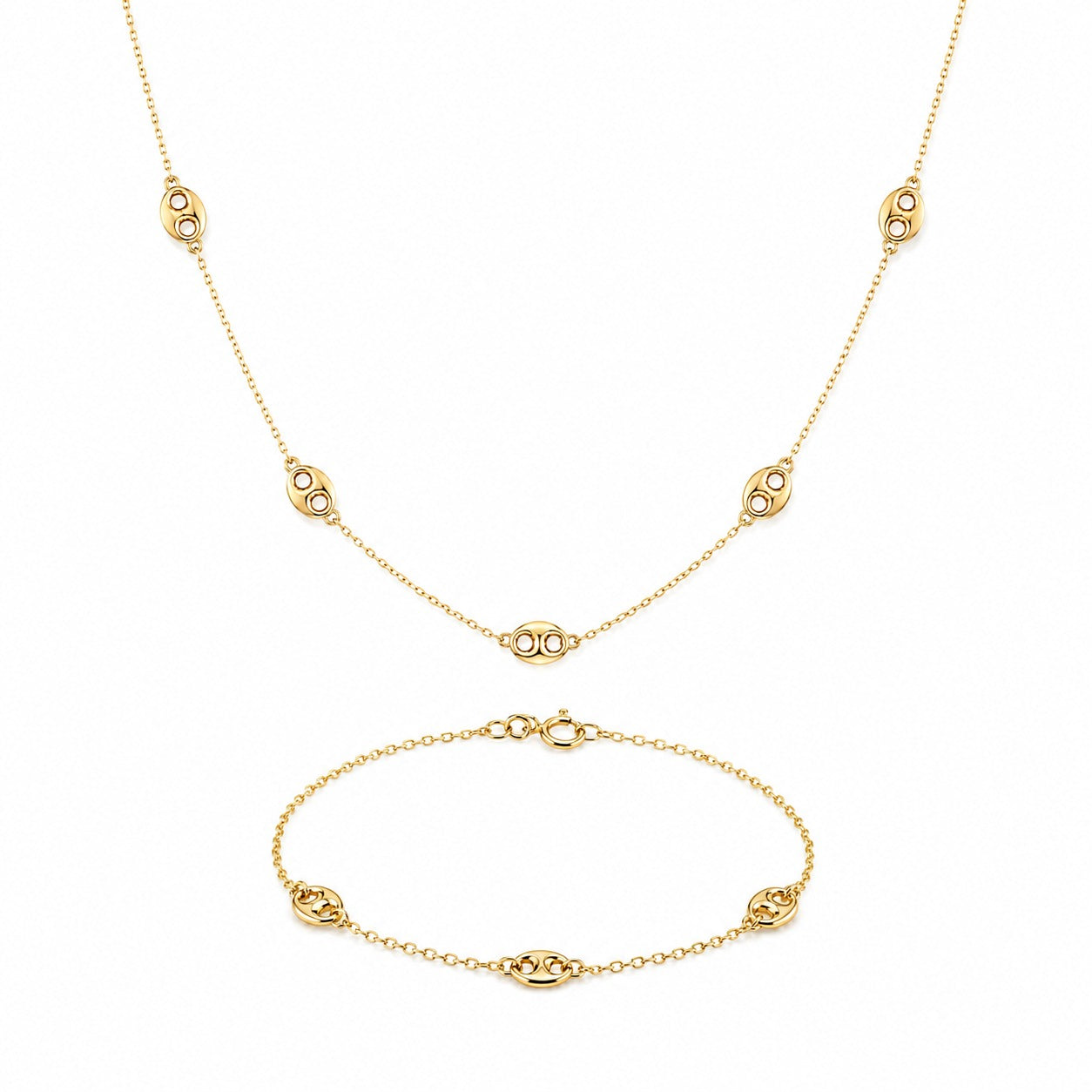 Gold necklace and bracelet set on a white background