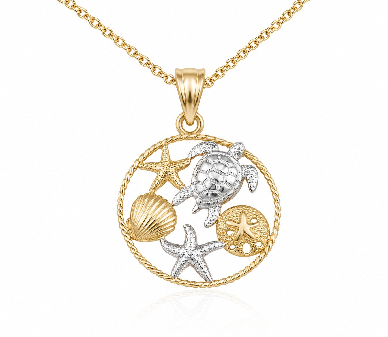 Gold and silver pendant with turtle, shell, and starfish on a white background