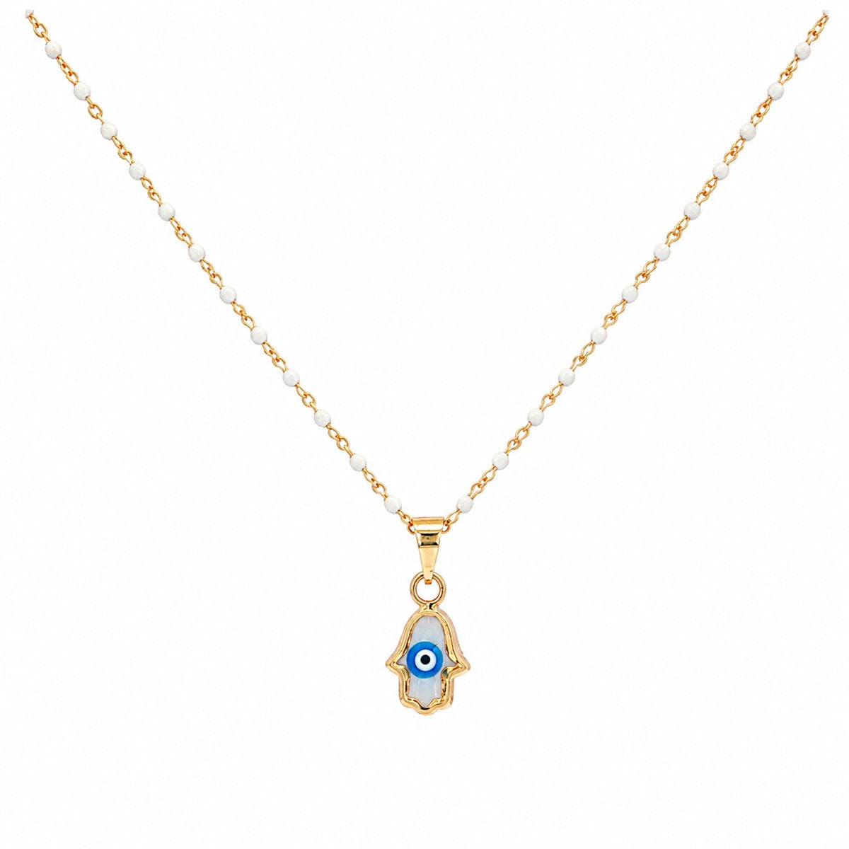 A delicate necklace featuring a gold-tone chain with small white beads and a Hamsa hand pendant. The pendant is detailed with a blue and white evil eye motif and a gold-tone Hamsa hand outline, set against a plain white background.