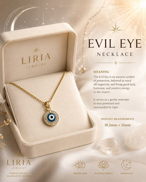 Liria Jewelry Evil Eye Necklace displayed in an open cream-colored presentation box, with product text and decorative elements on a warm beige background.