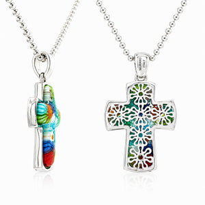 Two colorful cross-shaped pendants on silver chains with 'Murano Italy' inscription.