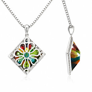 Colorful pendant necklace with a silver chain on a white background