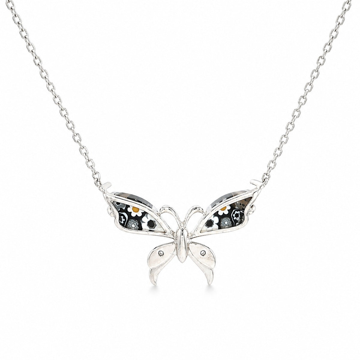 Butterfly-shaped silver pendant on a chain against a white background