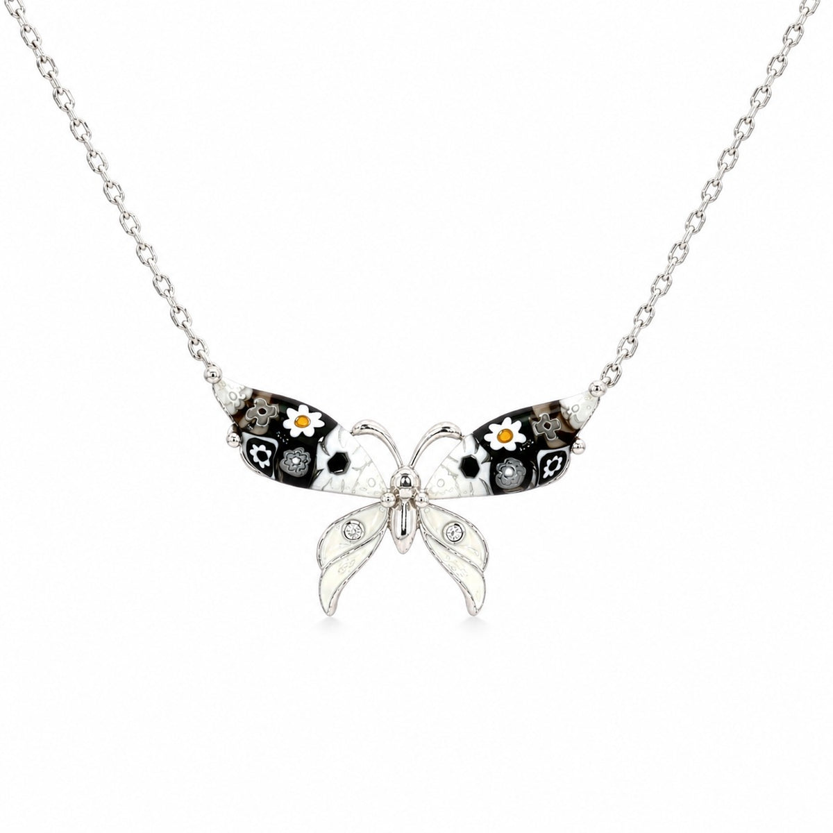 Butterfly-shaped necklace with floral details on a white background