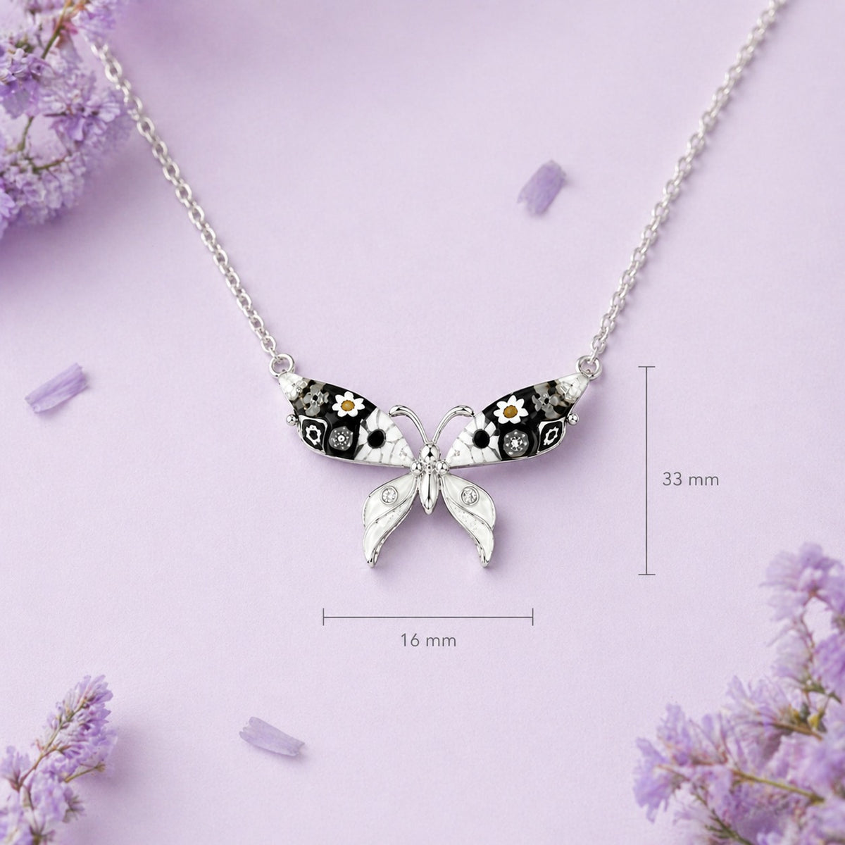 Butterfly-shaped necklace with floral details on a purple background