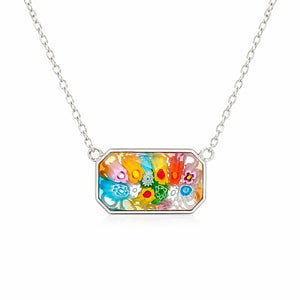 Necklace with a colorful floral pendant on a white background