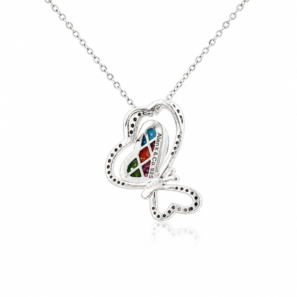 Butterfly-shaped pendant with colorful gemstones on a white background