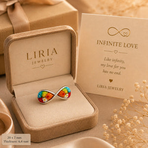 Elegant silver infinity-shaped ring featuring multicolor floral glass with vibrant Murano-inspired patterns
