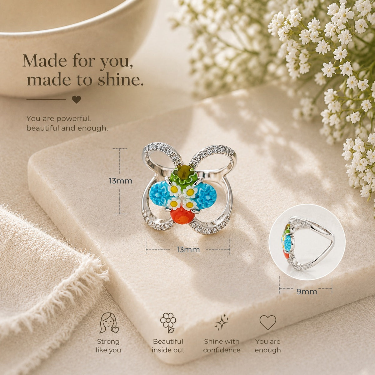Silver butterfly ring with colorful floral glass centerpiece and crystal details