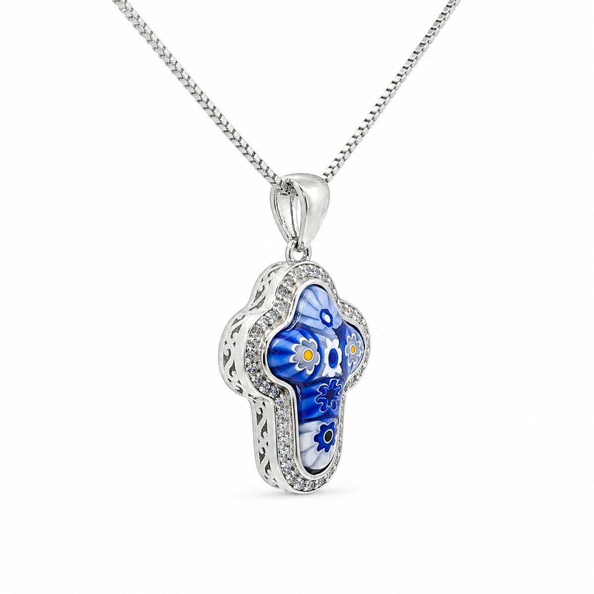 Silver pendant with blue and white floral design on a white background