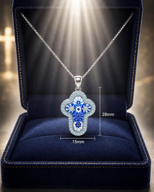 Blue floral pendant necklace in a blue velvet display box with measurements.
