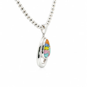 Silver necklace with a colorful pendant on a white background