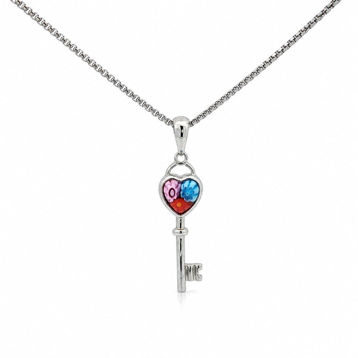 Silver key-shaped pendant with colorful heart design on a white background