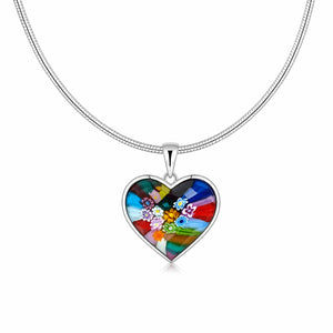 Heart-shaped colorful pendant on a silver chain against a white background