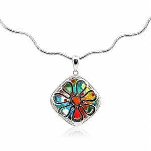 Colorful flower-shaped pendant on a silver chain against a white background