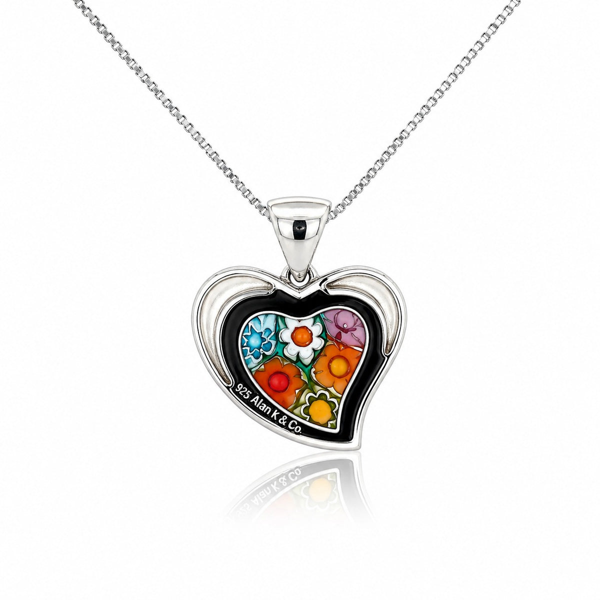 Heart-shaped pendant with colorful floral design on a white background