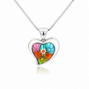 Heart-shaped pendant with floral design on a white background