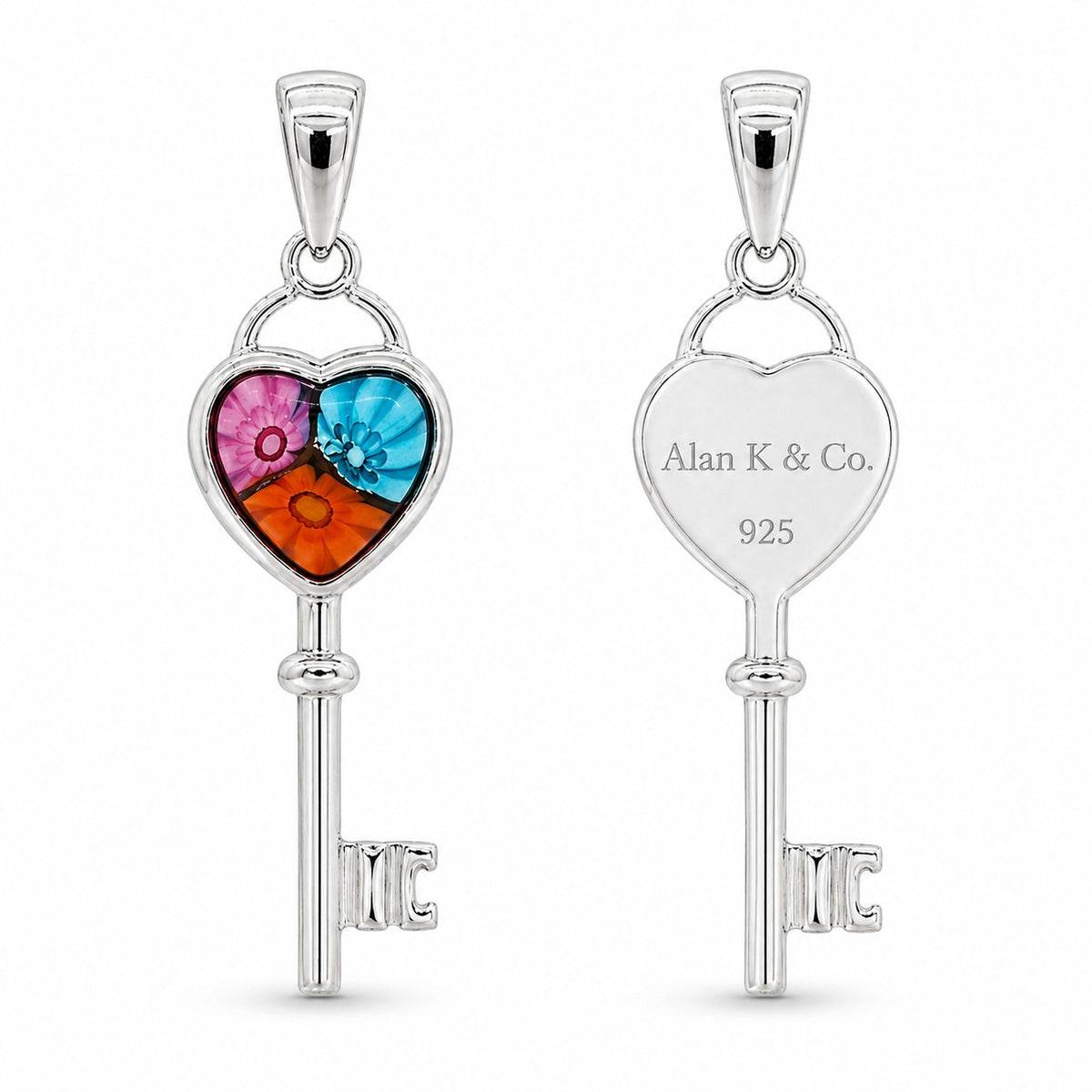 Two silver key-shaped pendants with heart designs on a white background