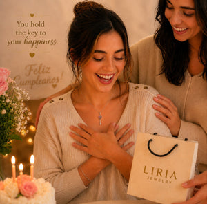 Two women with a LIRIA Jewelry gift bag, surrounded by flowers and candles, with a celebratory atmosphere.