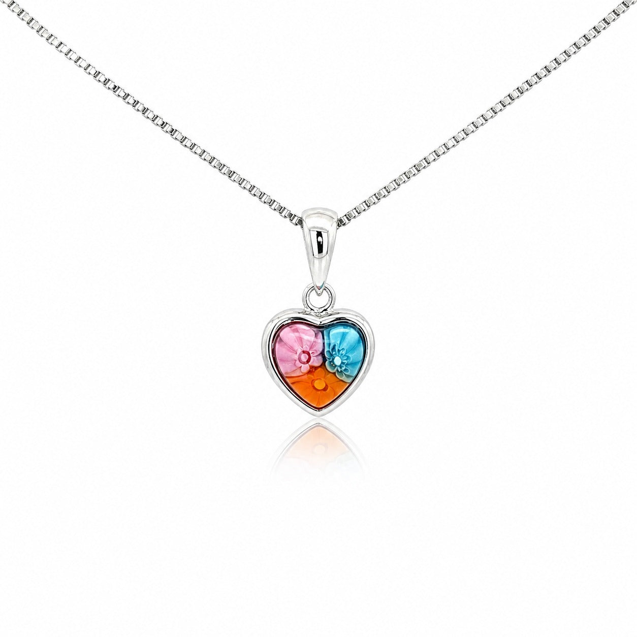 Heart-shaped pendant with colorful stones on a white background