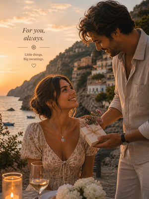 Couple sharing a romantic moment by the sea with a gift exchange.