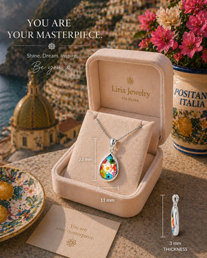 Liria Jewelry necklace in an open box with scenic background
