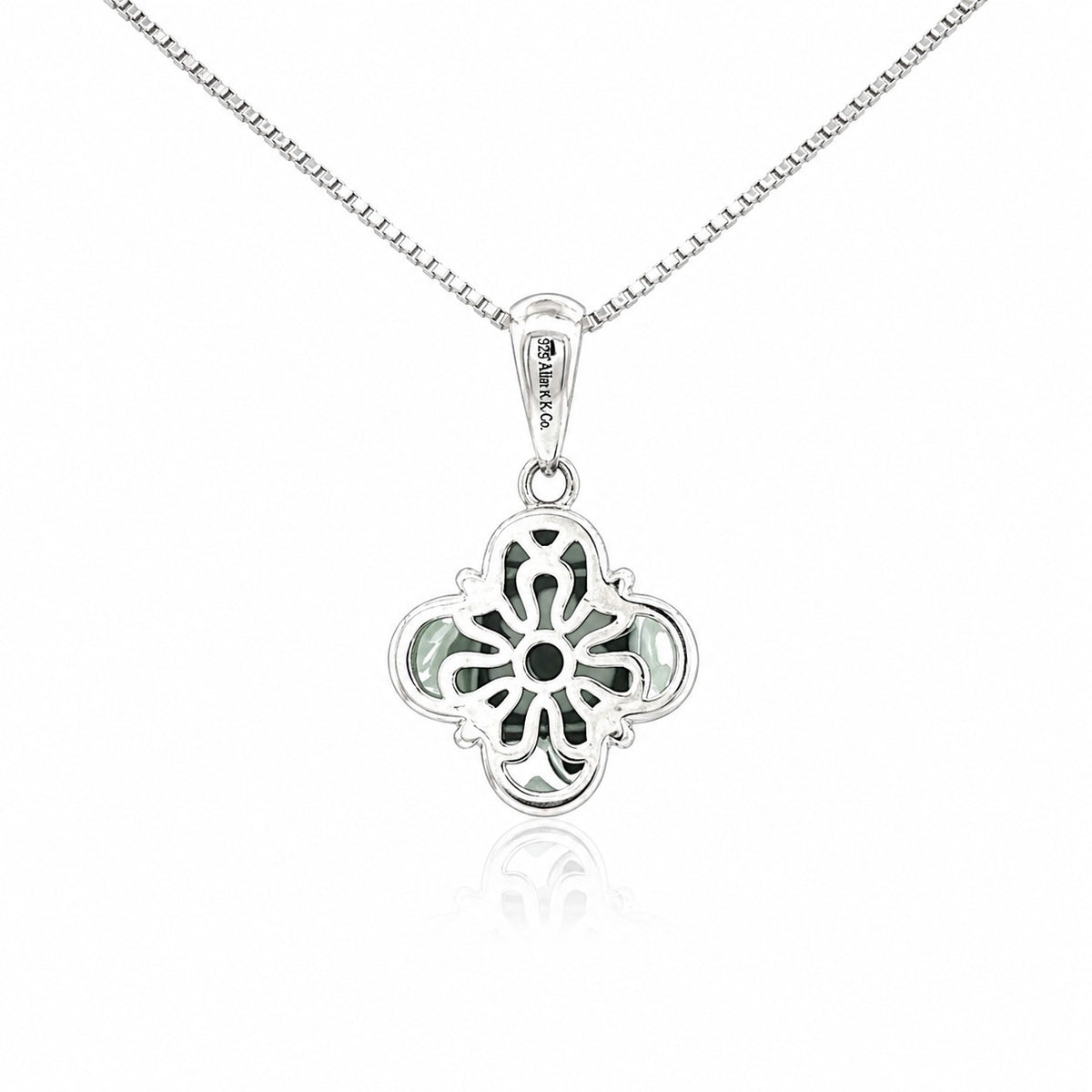 Silver quatrefoil pendant necklace on a white background