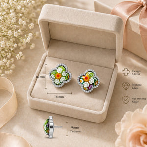 Colorful earrings in a jewelry box with floral decorations and measurements.