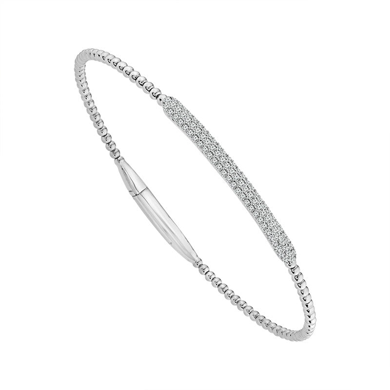 14K white gold diamond bracelet with a delicate beaded design and pavé diamond centerpiece displayed on an elegant beige marble background.