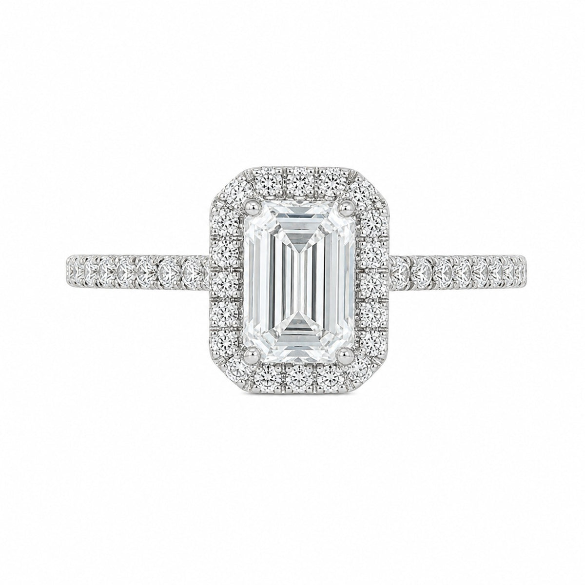 An emerald-cut halo ring featuring a central baguette diamond surrounded by a double halo of smaller round diamonds, with a pavé-set band in a silver-colored metal, shown on a plain white background.