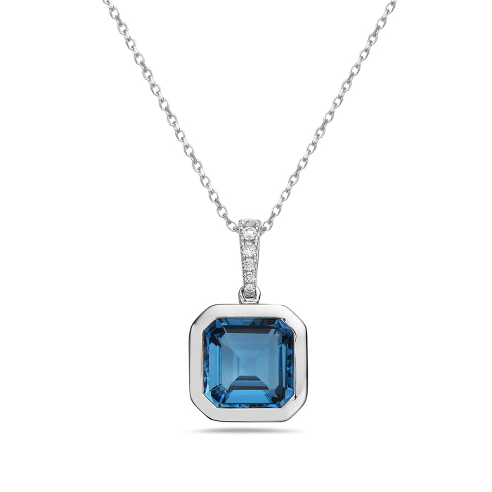 Blue gemstone pendant on a chain against a white background