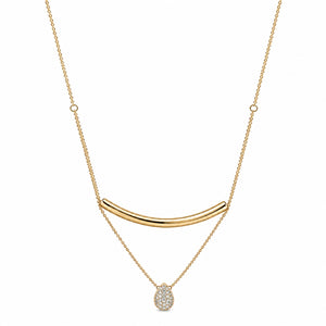A gold necklace featuring a curved bar pendant, a delicate chain with small circular links, and a teardrop-shaped pendant paved with clear stones, shown against a plain white background.