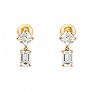 A pair of gold drop earrings featuring a brilliant round-cut clear gemstone above an emerald-cut clear gemstone, set in gold and photographed on a solid white background.