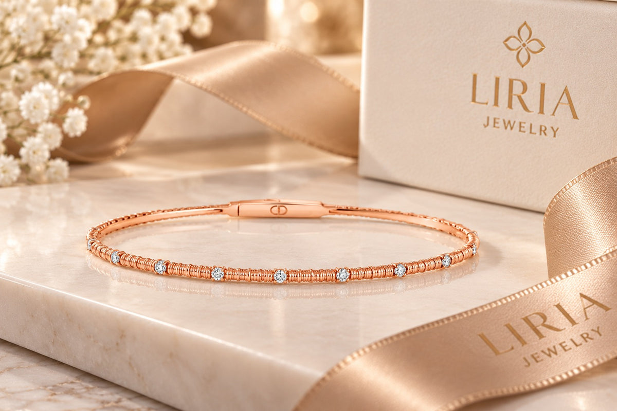 14K rose gold bangle bracelet with 13 diamond inlays and titanium center.