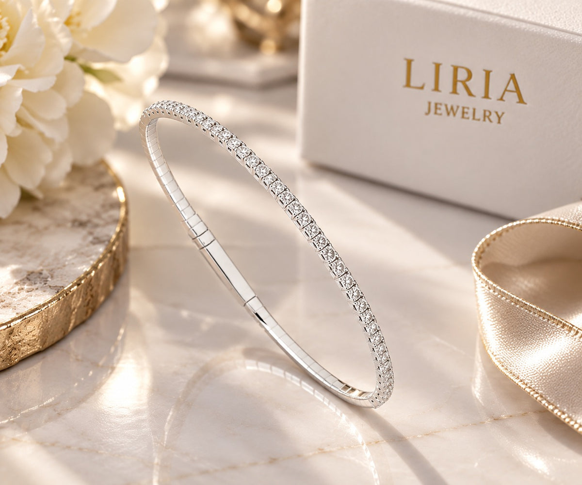 14K white gold and titanium bangle bracelet with sparkling diamond accents and a sleek, elegant design.