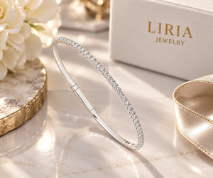 14K white gold and titanium bangle bracelet with sparkling diamond accents and a sleek, elegant design.