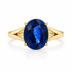 14K yellow gold ring featuring a 10 x 9mm oval deep blue sapphire in a four-prong setting.