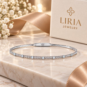 Silver bracelet with small diamonds on a white background