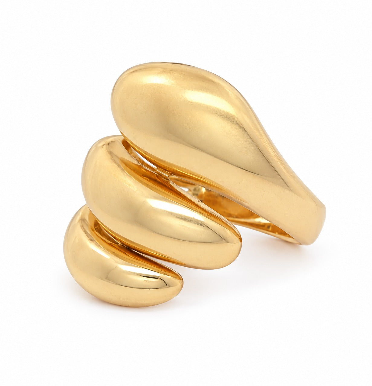 A polished gold ring with a sculptural, organic wavy design, photographed on a clean white background.
