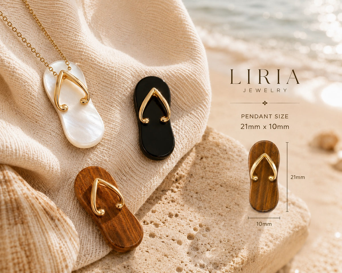 Jewelry pendants shaped like flip-flops on a textured surface with 'LIRIA' branding.
