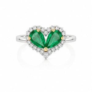 Heart-shaped ring with green pear-cut stones, white halo accents, and a polished white metal band.
